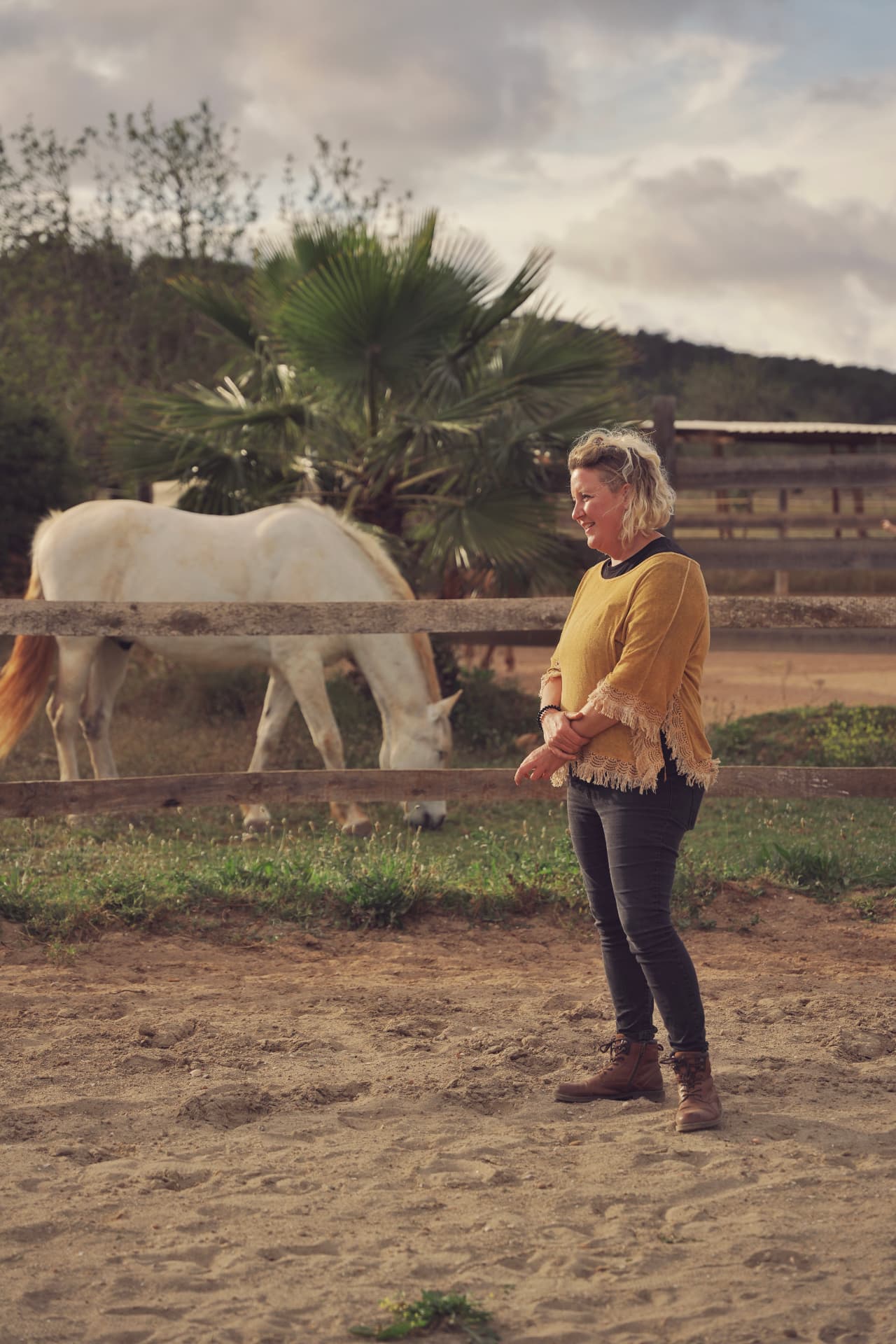 Joki at the farm with one of the horses during a session in Ibiza.