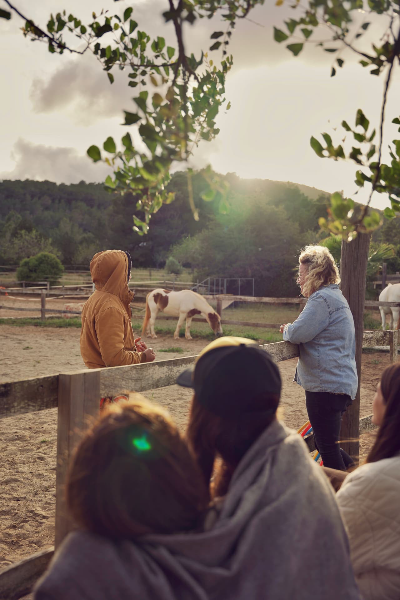 A quiet moment of inquiry between participant and facilitator at the fence.